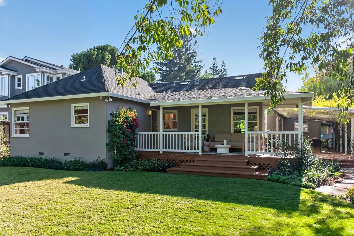 Single-story home with porch and green lawn