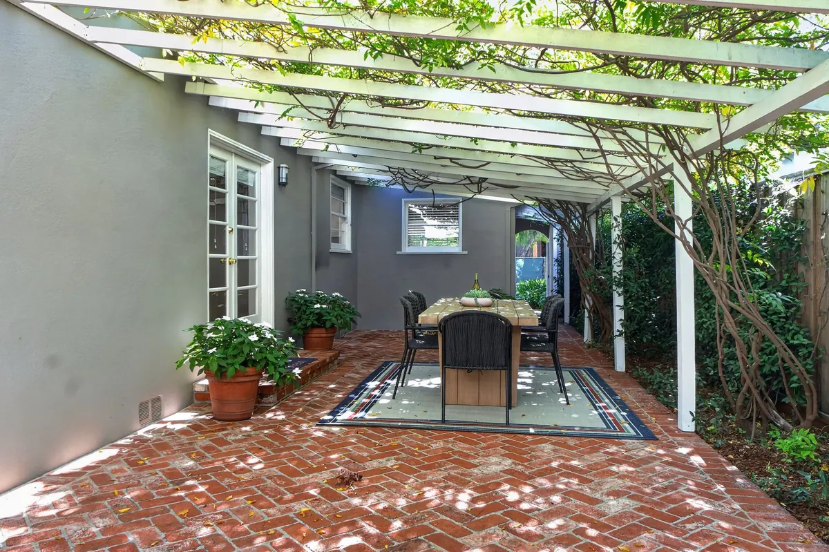 Brick patio under a pergola