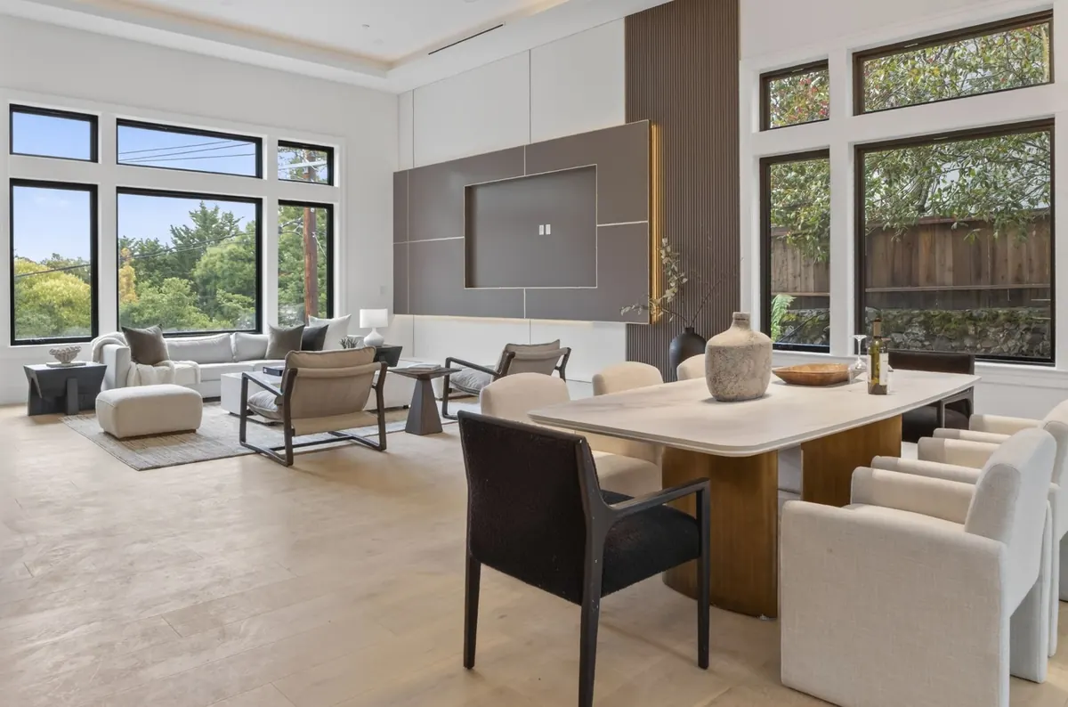 Open-plan living and dining room with large windows
